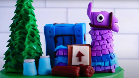 Fortnite cake: a cake topper is shown in the shape of the Fortnite loot llama 