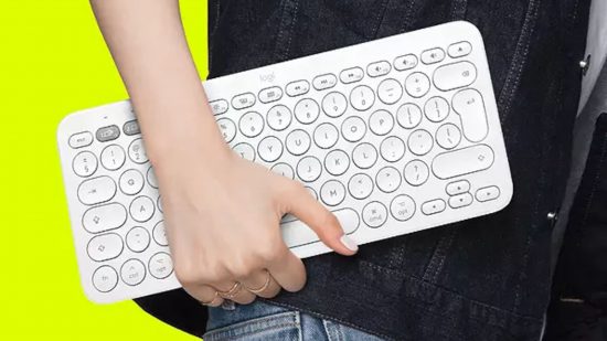 A hand holding one of the best mobile keyboards