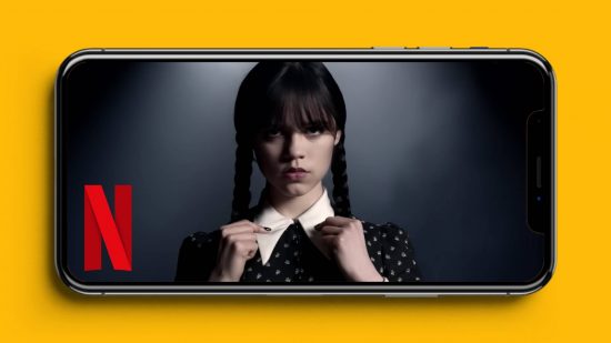 Netflix download: an iPhone is visible, with Wednesday Addams in the middle of the screen, and the Netflix logo next to her