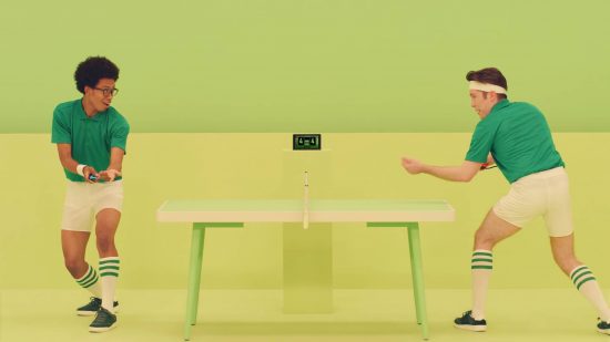 Ping Pong games: two people play ping pong in a green room, with a Nintendo Switch keeping score in the background