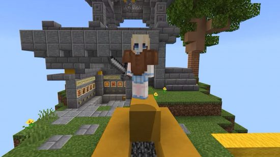 Minecraft games: a player standing on top of a block holding a sword