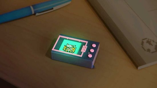 Digimon World: Next Order Switch review - a Digivice sat in the middle of a wooden table