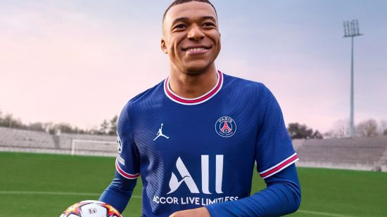 FIFA 23 career mode - Kylian Mbappe, holding a football, looking happy, ona green football pitch with bright sky behind him.He has short shaved hair and a PSG kit on.