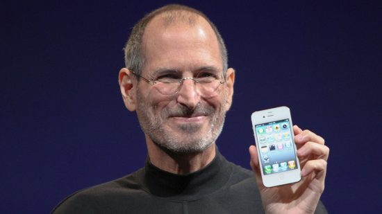 iPhone auction - Steve Jobs holding up an original iPhone