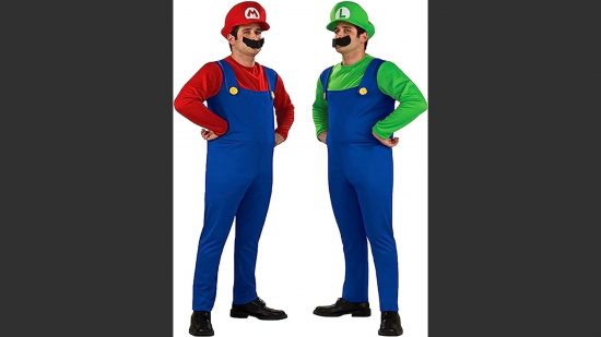 Mario and Lugi costumes; two men in dungarees, t-shirt, and one hat, with hands on hips. The one on the left is in a red tshirt and hat, one is in a green tshirt and hat.