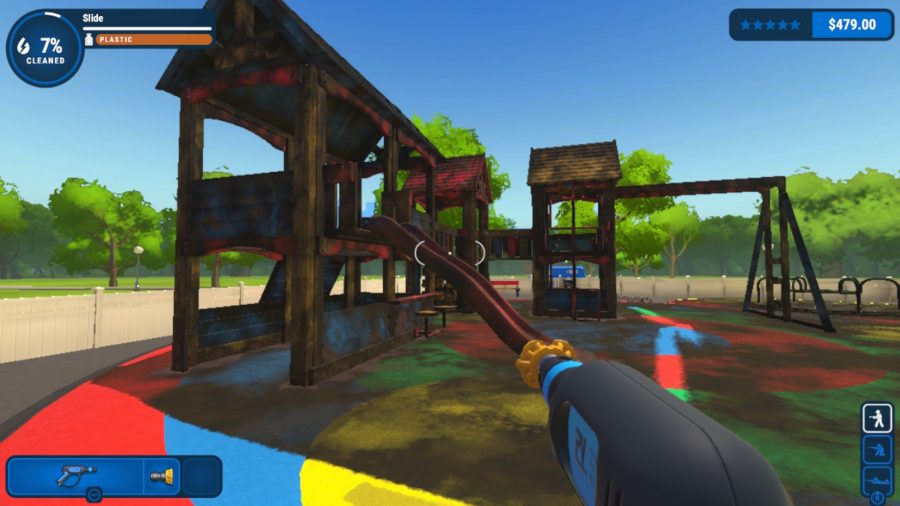 PowerWash Simulator: A screenshot from the game showing a dirt-covered climbing frame in a park from the POV of someone holding a power washer.