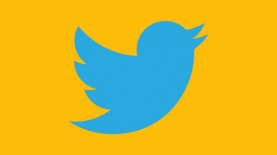 What is Twitter - the Twitter logo on a mango-yellow background. It's a 2D light-blue bird, facing to the right, wings out behind it, beak half-open -- like the silhouette of a Bluebird or a Robin or a Starling, not a large bird or anything like that. A cartoony light-blue Bluebird's silhouette.