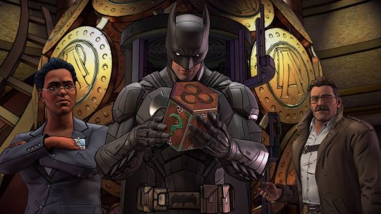 Batman games - Batman looks at a box with a question mark on it, in a building with large gold circles adorning the background, next to a woman in a suit and a man in a tie-less suit.