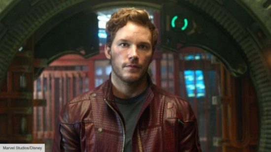 Chris Pratt Mario movie voice - Chris Pratt, a white man with short neat hair and clean facial hair, a dark t-shirt and brown leather jacket on, in a shot from one of his movies.