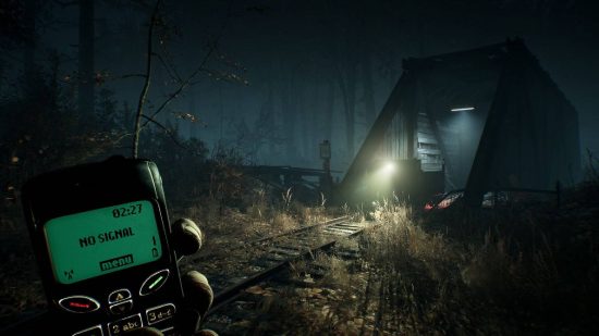 Ghost games: a first-person views shows a person walking through the darkness, with a mobile phone held up