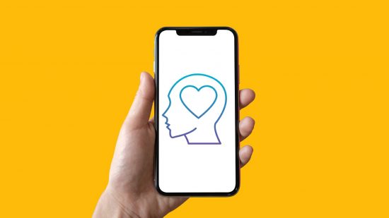 Mobile wellness apps: a hand holds a mobile phone, with an icon featuring a head, with a heart where the brain
