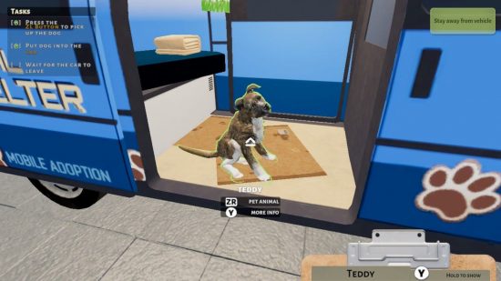 Animal Shelter Simulator review: a dog sat in a van waiting to drive off