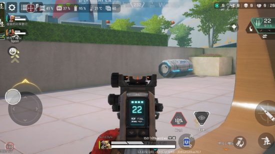 Asus ROG Phone 7 review- screenshot of Apex Legends, a first person shooter, with a gun in the middle and various buttons around for the touchscreen, in front of a grass hedge, grey patio, and strange cylinder glowing blue on its side.