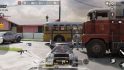 Asus ROG Phone 7 review -- screenshot from call of duty, a shooter, showing a gun in the middle, two buses in from of a cloudy sky mid-game.