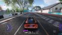 Asus ROG Phone 7 review -- screenshot from Ace Racer, showing a car driving down a street with trees and armco either side.