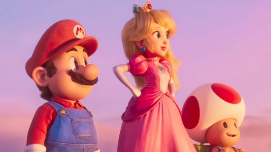 Mario movie box office - Mario, princess Peach, and Toad stood against a red and blue sky. Mario is a man with a bushy moustache, red hat and shirt, and blue dungarees. Peach is a woman with long blonde hair below a small crown in a pink regal dress. Toad is a smaller thing with a mushroom for hair.