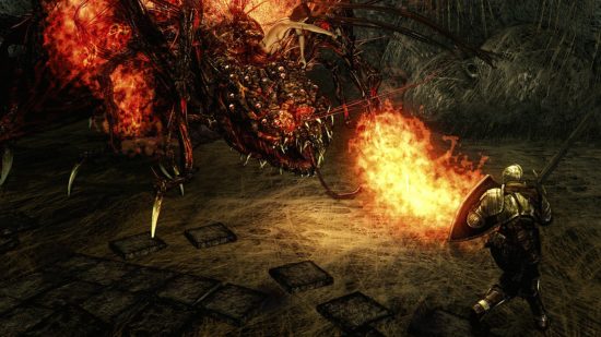 Dark Souls Quelaag breathing fire against a player's shield