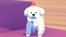A small white Pupperazzi dog wearing a pink party hat and a white shirt with a blue tie, standing on a purple surface and staring directly into the camera with a blank expression.