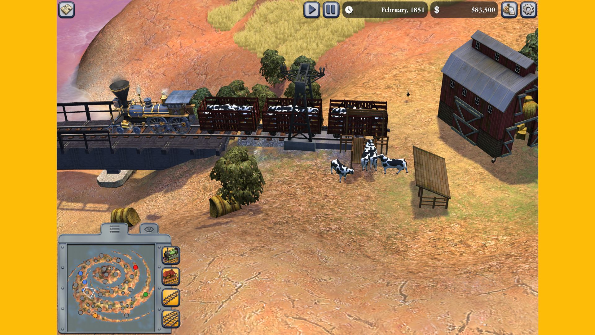 Recenzja Sid Meier's Railroads - ładunek krów na piaszczystej ziemi wsiadających do ciężarówek za torami kolejowymi.