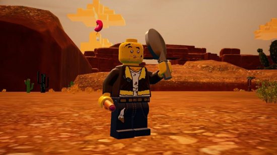Lego 2K Drive review: A lego man stands in an open desert area
