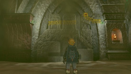 Zelda Tears of the Kingdom divine beast: Link standing in front of a carved stone wall