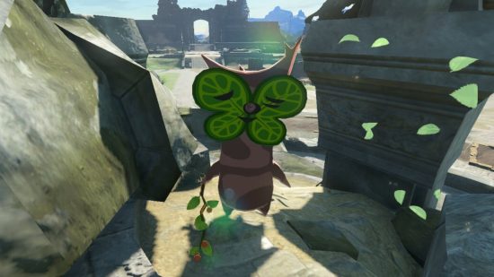 Zelda Tears of the Kingdom koroks - a korok, a cute forest spirit that looks like a mix of broccoli and leaves yet is humanoid-ish with a leaf for a face. It is surrounded by hearts and a crying cute emoji.