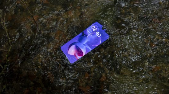The Doogee S100 Pro torch being tested in a river