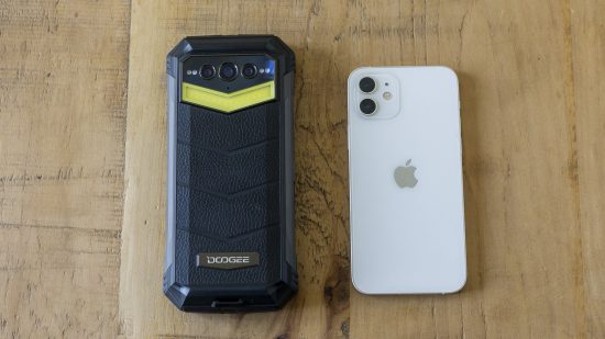 The Doogee S100 Pro phone size compared to the iPhone 12