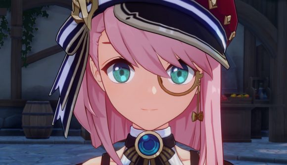 Genshin Impact Charlotte: A zoomed-in screenshot of Charlotte's face showing her pink hair, green-blue eyes, and monacle.