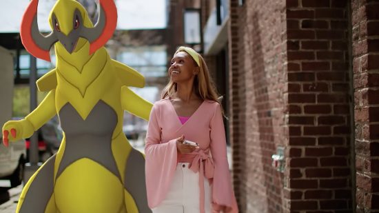 Pokemon Go events - a girl and her Haxorus walk down a busy street