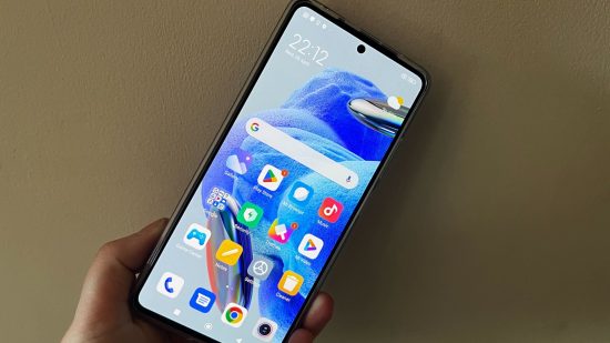 Redmi Note 12 Pro 5G review - the phone in front of a wall
