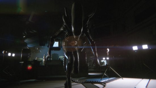 Science games: A screenshot from Alien: Isolation showing a xenomorph approaching the player and towering over them.