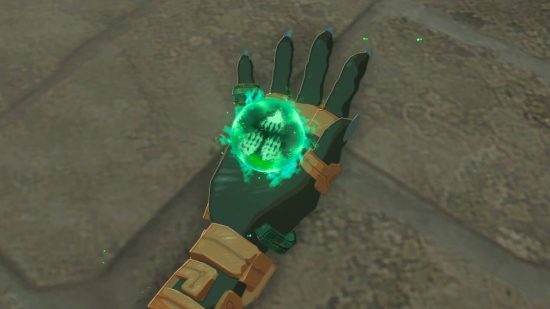 Zelda: Tears of the Kingdom autobuild: Link's hand shines with a new ability, while a symbol made of three hands is visible