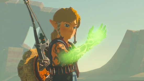 Zelda Tears of the Kingdom Metacritic - Link, a blonde boy with a glowing green arm, he is looking at it in a cloudy stony space. He has a bow and arrow and sword on his back.