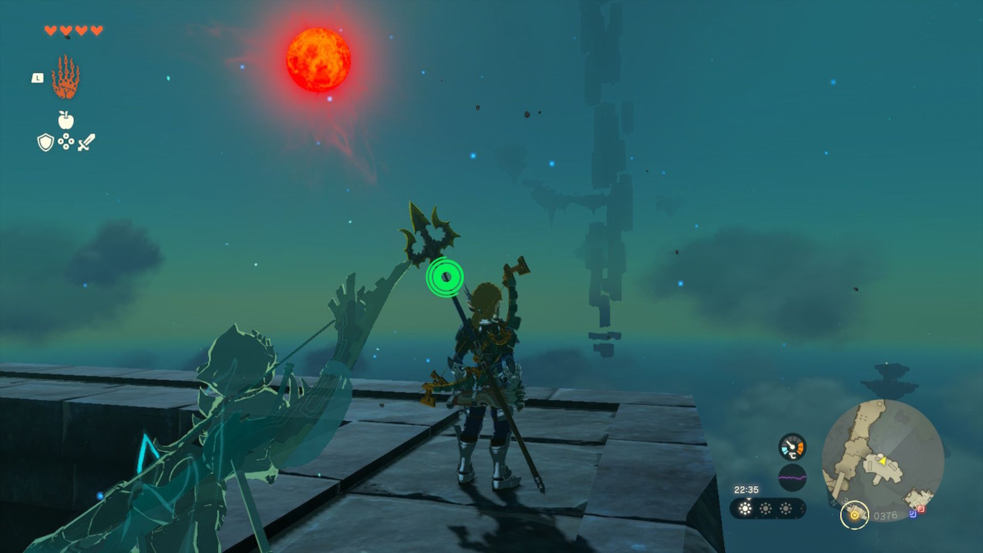 Zelda Tears of the Kingdom review - Link, a blonde man with a trident on his back stood next to a bird creature on a stony platform looking out at a green and blue sky with a couple of clouds and a red moon. In the distance, geometric shapes float in the sky upwards in a loose pillar.