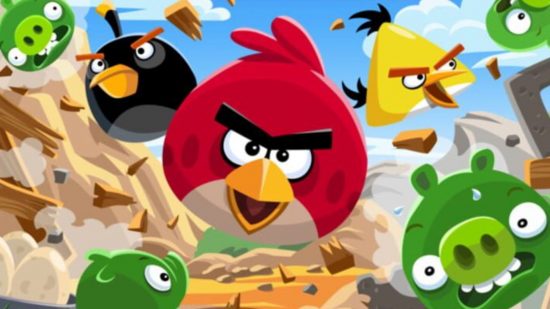 Angry Birds Mystery Island release date header showing various spherical birds with cartoon faces flying through the air in various colours, red yellow green and black. Looking freaky,