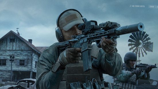 Arena Breakout release date header showing a man in tactical military armour with ear defenders and a cap holding an assault rifle up to his eye as if ready to shoot someone. Everything is grey and there's a barn in the background.