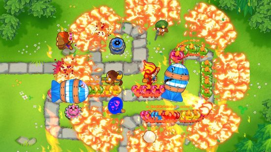 Offline game Bloons TD6 showing a top down view of dozens of explosions and blimps on a grassy plain as monkeys try to destroy everything.