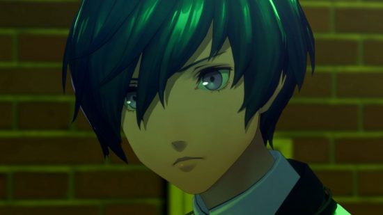 Persona 3 Reload Switch - a man lit by green light with close swept hair over their eyes and a white collar.