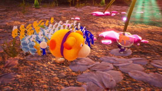 Pikmin 4 review - Oatchi surrounded by Pikmin following a humanoid character