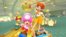 Screenshot of key art from the Mario Kart Tour Sunshine Tour trailer with Toadette and Daisy on screen