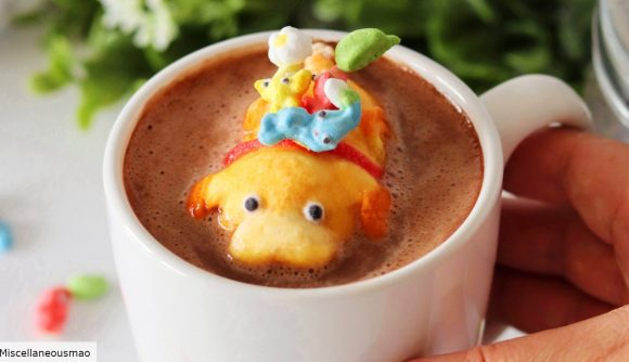 Pikmin 4 sweets: A photograph of Miscellaneousmao's marshmallow version of Oatchi and the Pikmin in a white mug filled with hot chocolate