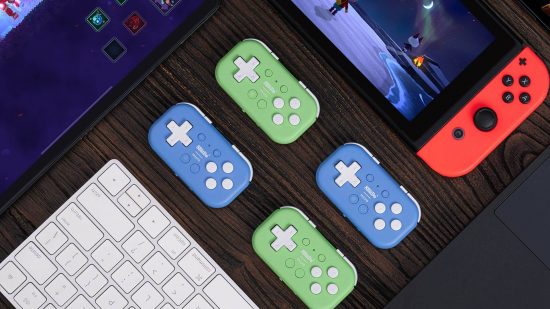 8BitDo Micro Controller: four small controllers are on a desk, two blue, and two green