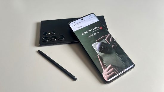 Xiaomi 13T Pro header showing two phones, one in all black flat on its face on a grey surface next to a black stylus. The other is leaning on the other phone, with its screen showing the Xiaomi website with the 13 Ultra on display.