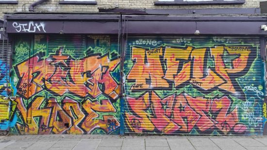 ASUS Zenfone 10 review: A photo shot on the ASUS Zenfone 10 shows a colorful shop shutter covered in graffiti