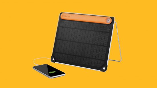 Best power banks: The Biolite SolarPanel portable charger charging an iPhone on a mango background