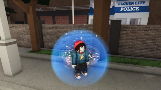 Clover City codes: A brown-haired Roblox character with a red beanie and a pizza shirt on, surrounded by a spherical blue force field and standing in front of a brick wall in front of the 'Clover City Police' building