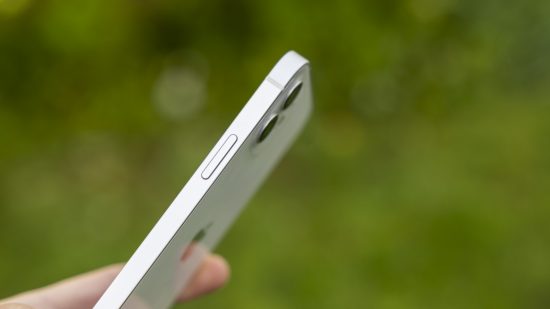 A side view of a white iPhone 12 showing the lock button