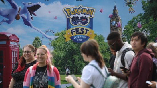 Pokemon Go Kim Adams Interview: Players interact in front of a Pokemon Go fest sign