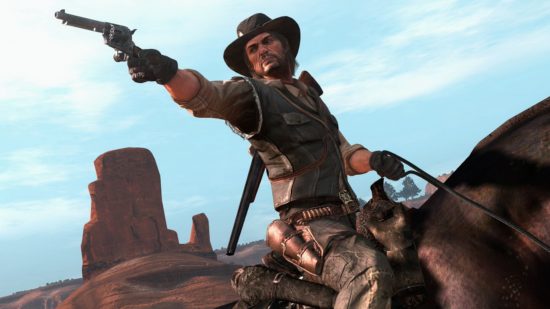 Red Dead Redemption Switch release date: The main character sat on his horse, pointing a gun at something in the distance. The sky is blue and there is a rock pillar in the background